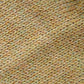 Close-up of the soft knitted texture of the handmade light yellow baby hat, made from 100% baby alpaca wool.