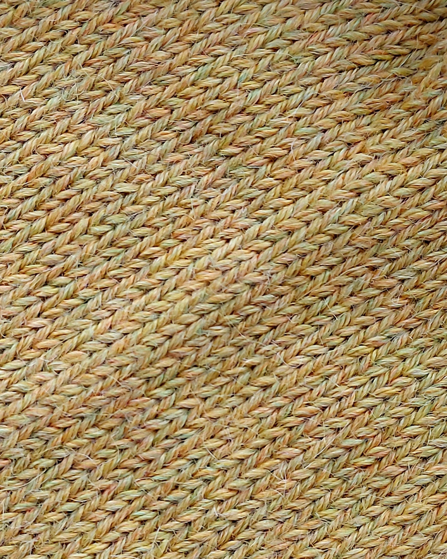 Close-up of the soft knitted texture of the handmade light yellow baby hat, made from 100% baby alpaca wool.