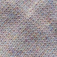 Close-up of the knitted texture on the handmade light pink baby hat, made from 100% baby alpaca wool.