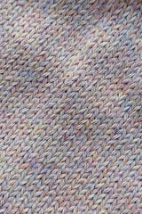 Close-up of the knitted texture on the handmade light pink baby hat, made from 100% baby alpaca wool.