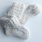 Handmade knitted baby socks with folded ankle cuffs, made from 100% baby alpaca wool, soft and stretchy.