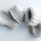 Handmade knitted baby socks with folded ankle cuffs, made from 100% baby alpaca wool, soft and stretchy.