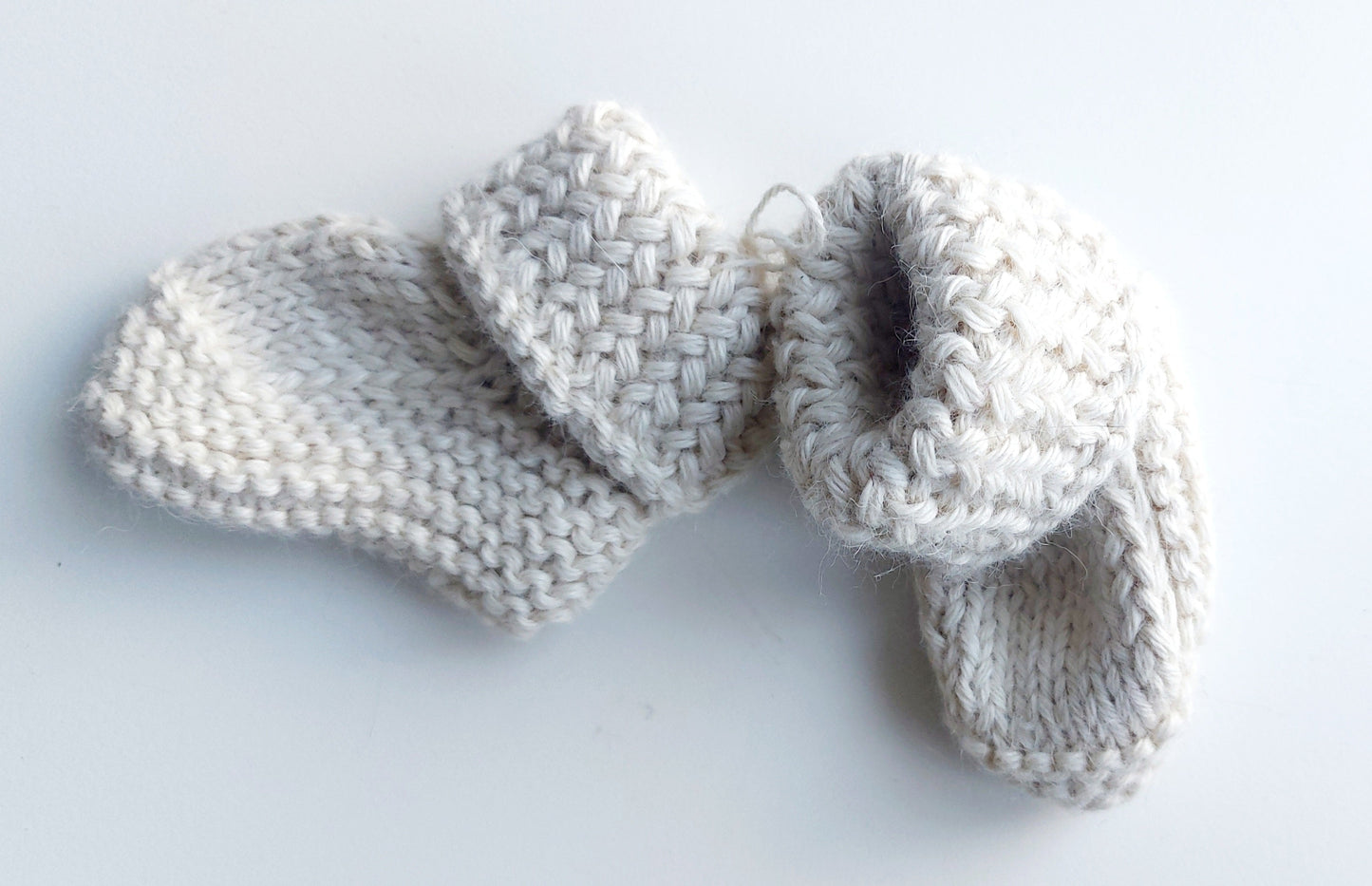 Handmade knitted baby socks with folded ankle cuffs, made from 100% baby alpaca wool, soft and stretchy.